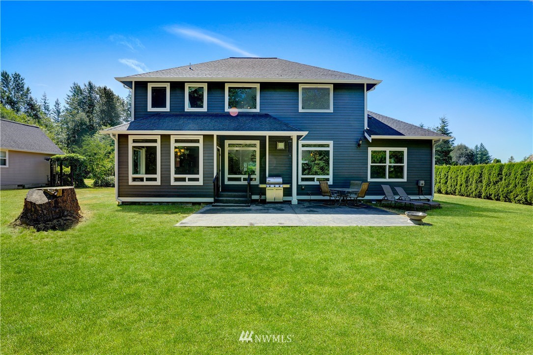 1290 West Axton Road Ferndale, WA 98248 - Photo 34 of 36 a view of a house with a yard