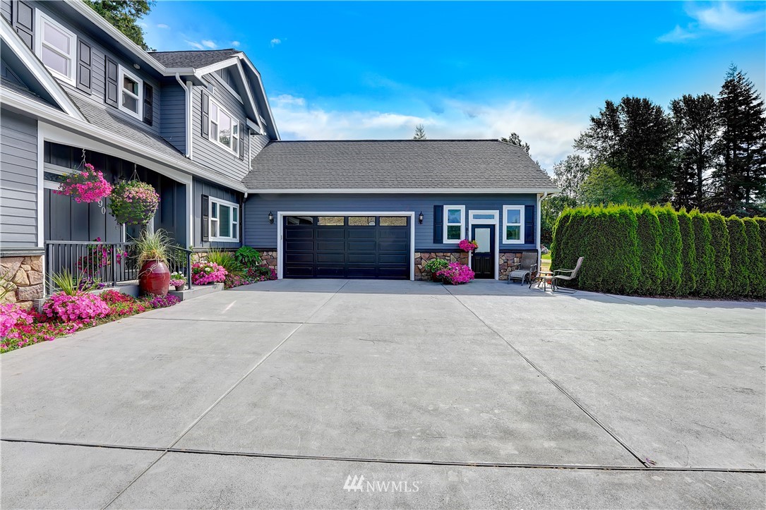 1290 West Axton Road Ferndale, WA 98248 - Photo 6 of 36 a front view of a house with a yard