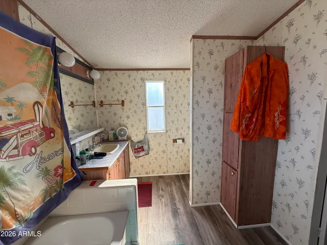 a bathroom with a bathtub and shower