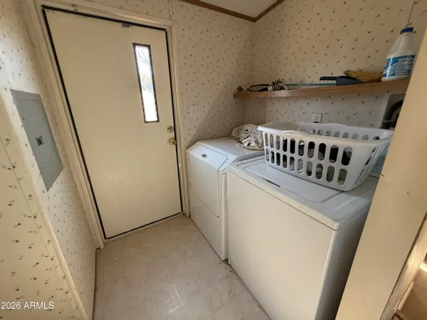 a utility room with dryer and washer