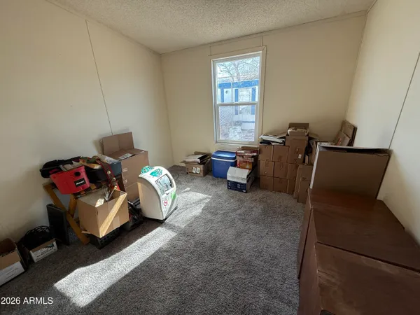 a bedroom with bed and a window