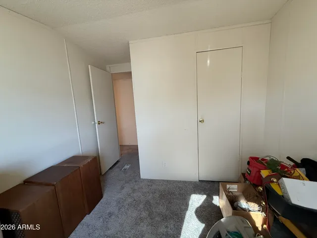 a view of room with couch and closet