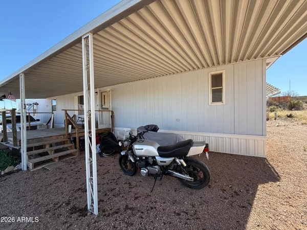 a backyard of a house with outdoor seating