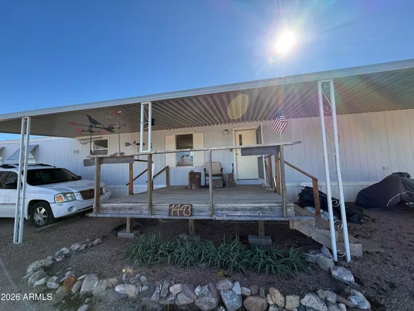 a view of a car park in front of house