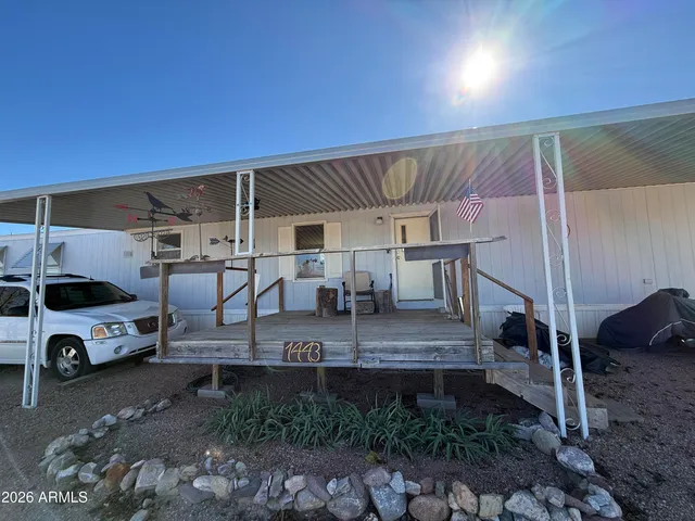 a view of a car park in front of house