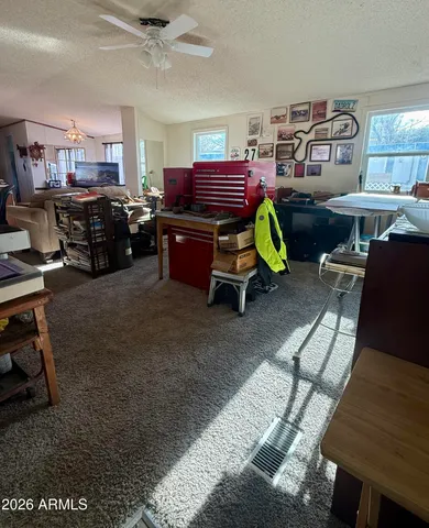 a living room with furniture a table and chairs