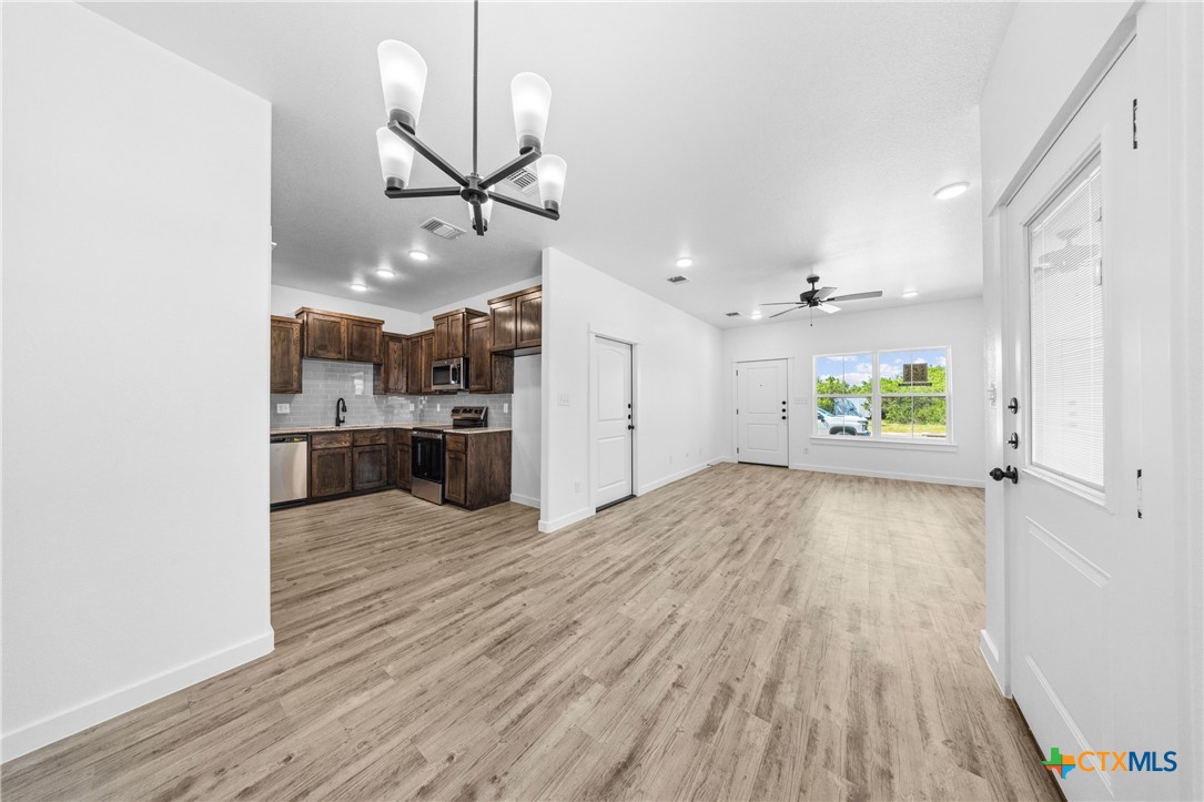 3606 Canvasback Road, Unit B Killeen, TX 76542 - Photo 16 of 19 a view of a kitchen with a sink and wooden floor