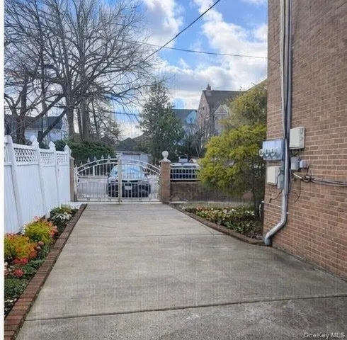 a view of a garden with sitting area
