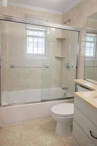 a bathroom with a toilet a sink and shower