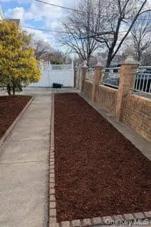 a view of a pathway with a yard
