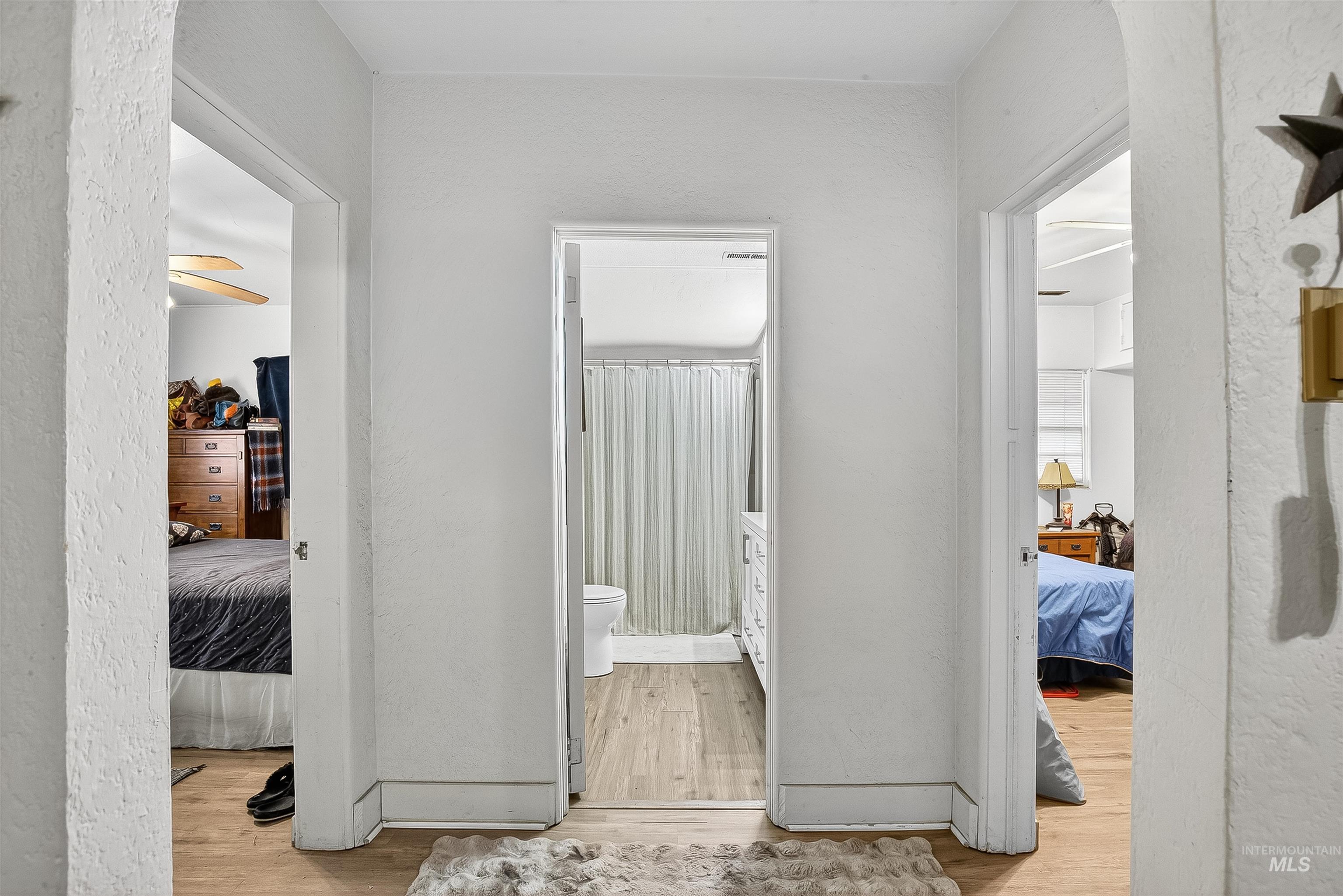 705 28th Street North Lewiston, ID 83501 - Photo 11 of 34 Hallway with a textured wall and light wood-style floors