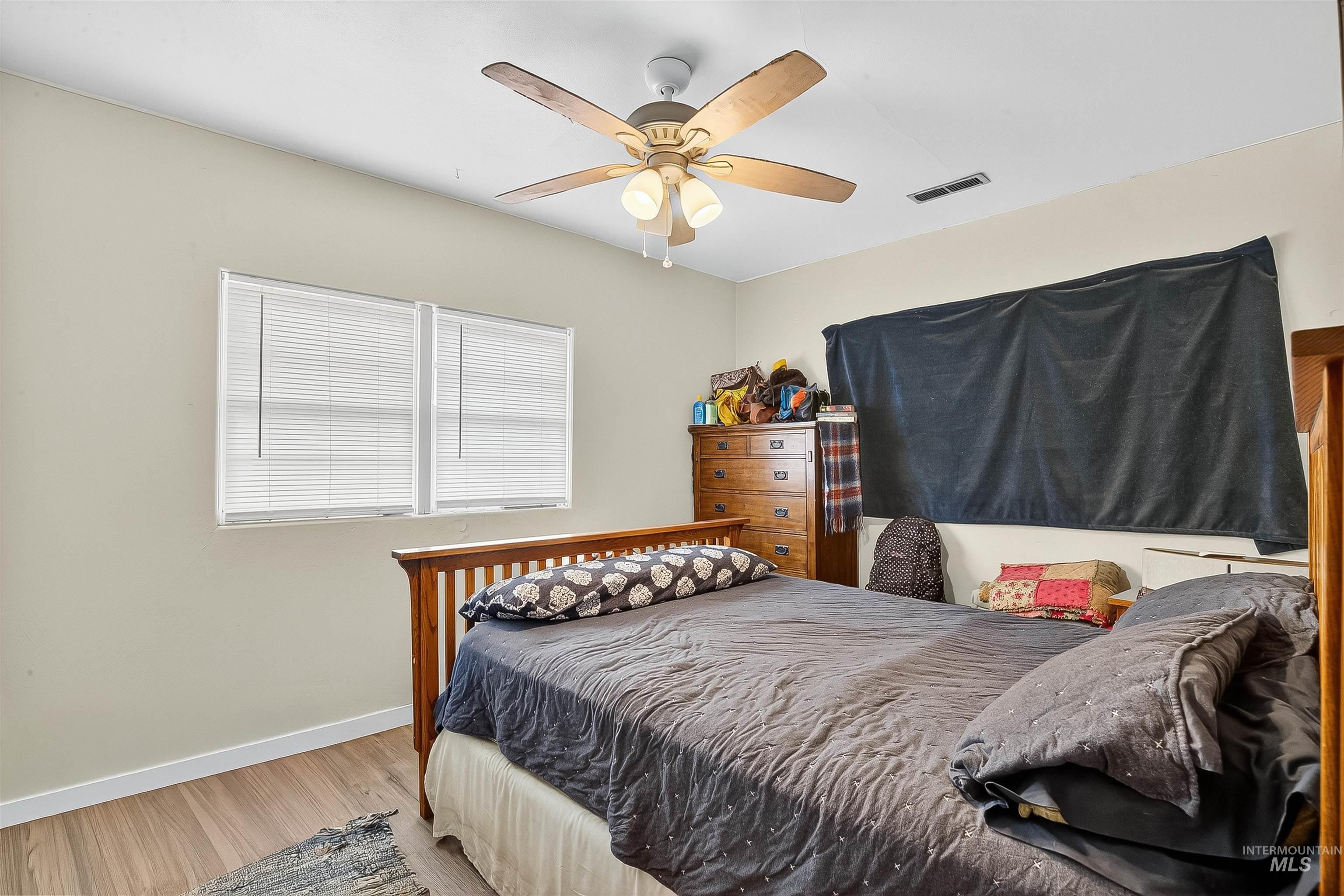 705 28th Street North Lewiston, ID 83501 - Photo 13 of 34 Bedroom featuring wood finished floors and ceiling fan