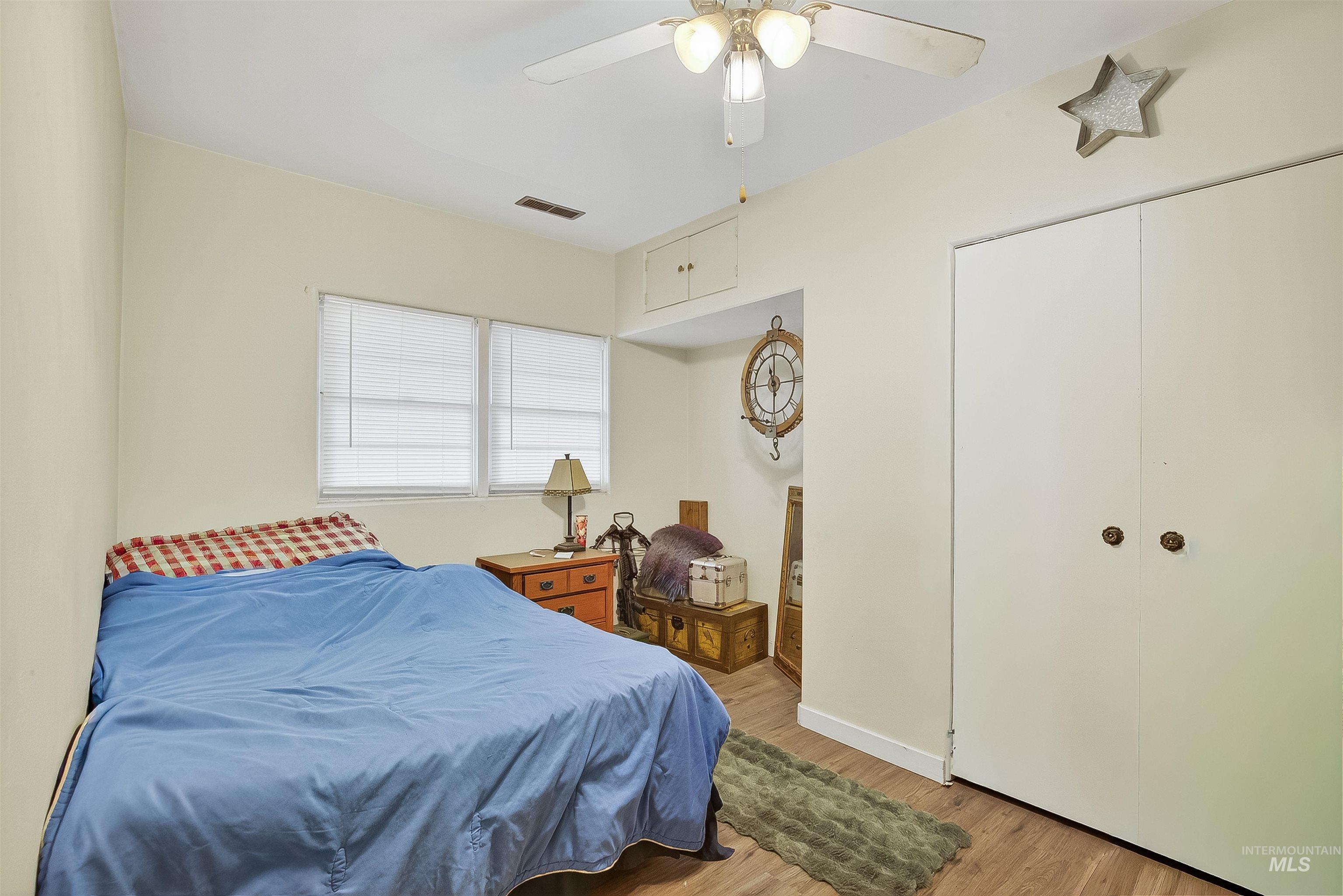 705 28th Street North Lewiston, ID 83501 - Photo 14 of 34 Bedroom featuring light wood-style floors and a ceiling fan