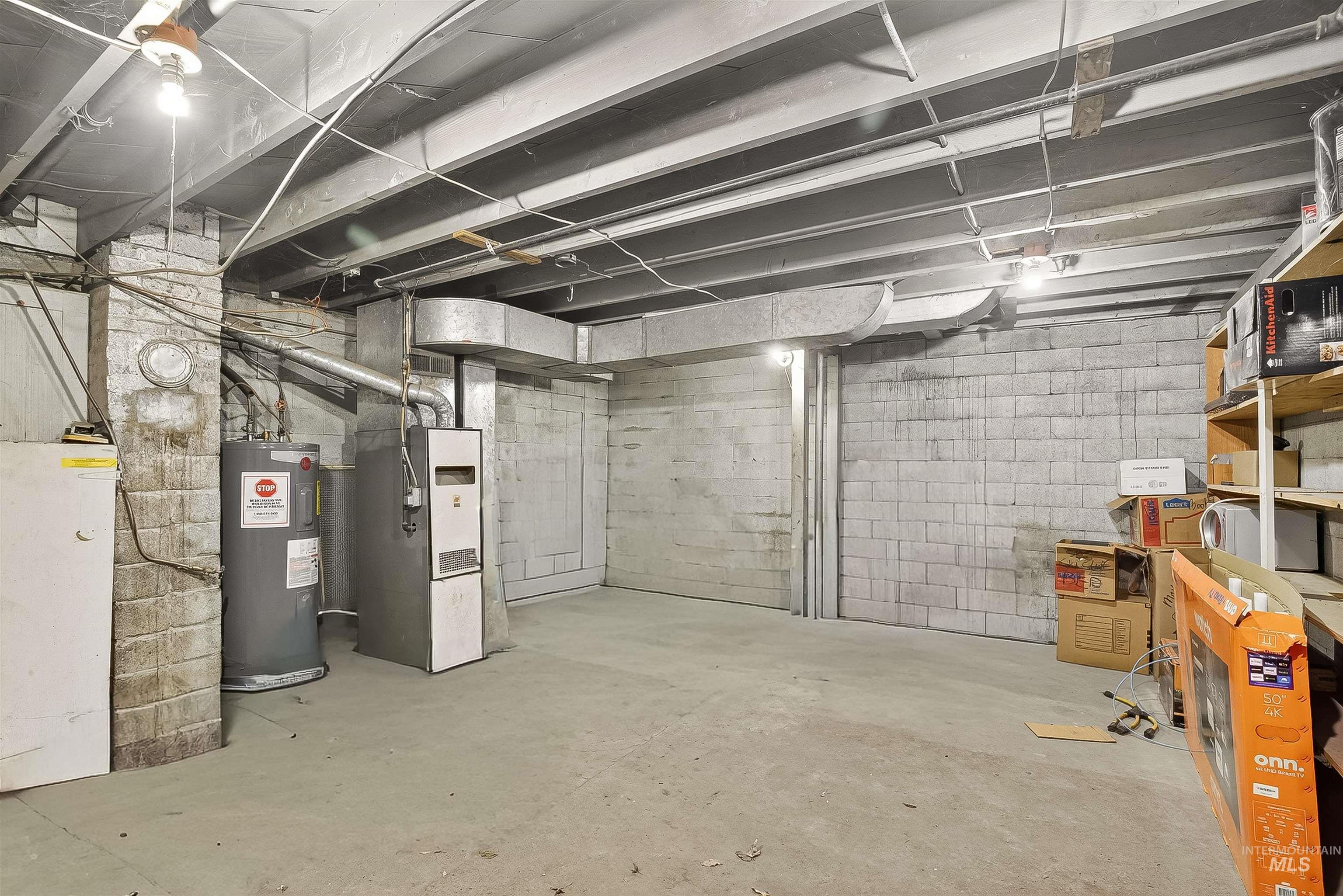 705 28th Street North Lewiston, ID 83501 - Photo 18 of 34 Unfinished basement featuring electric water heater and heating unit