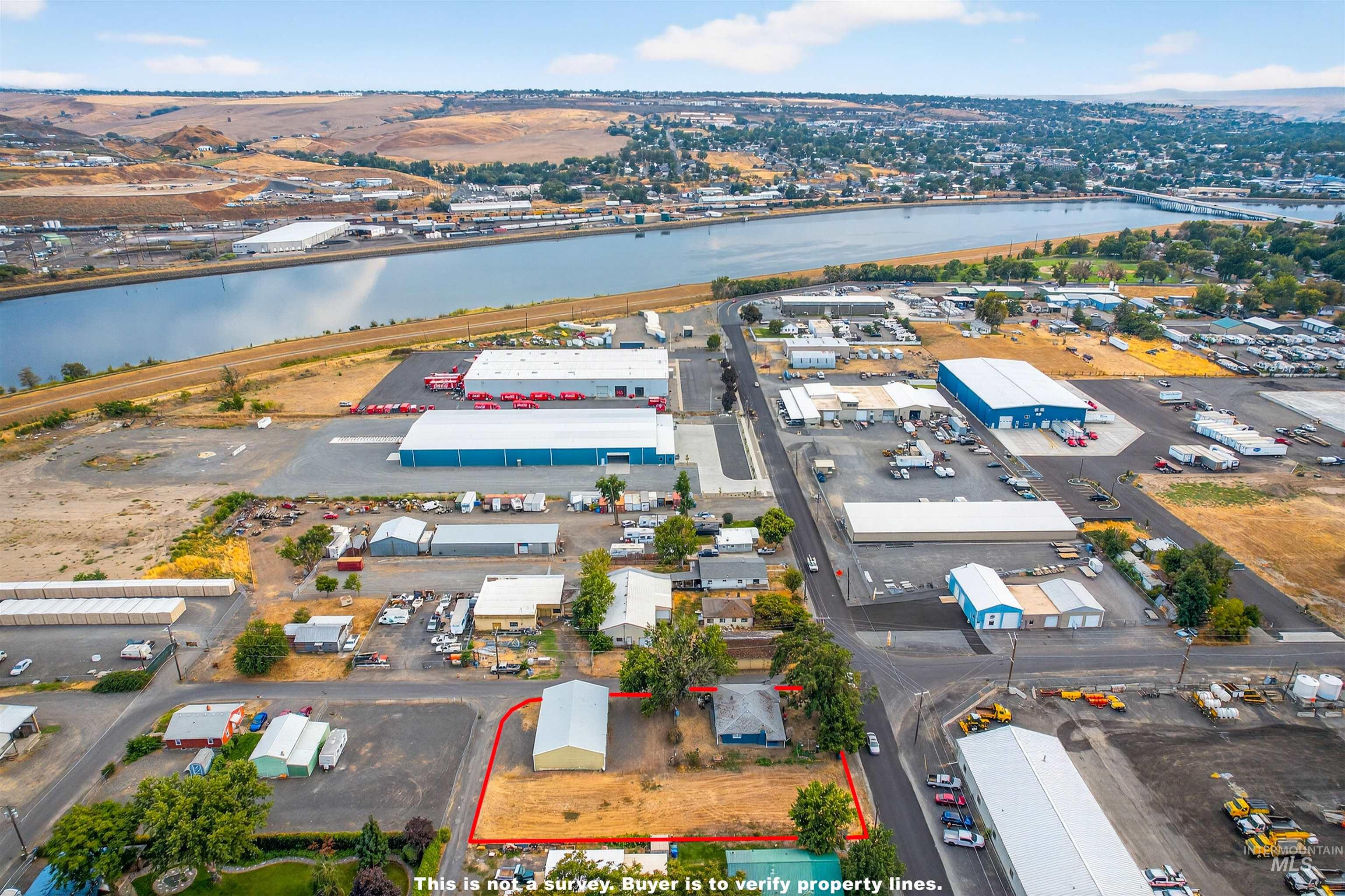 705 28th Street North Lewiston, ID 83501 - Photo 32 of 34 Aerial overview of property's location with a nearby body of water and property boundaries highlighted
