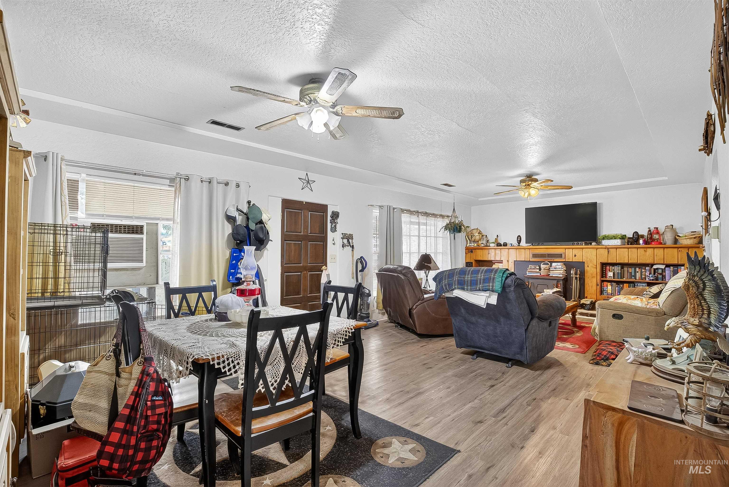 705 28th Street North Lewiston, ID 83501 - Photo 7 of 34 Dining area with light wood finished floors, a textured ceiling, and a ceiling fan