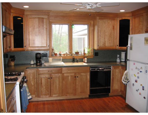 105 Rockwood Road Norfolk, MA 02056 - Photo 3 of 8 a kitchen with stainless steel appliances granite countertop a stove a sink and a microwave