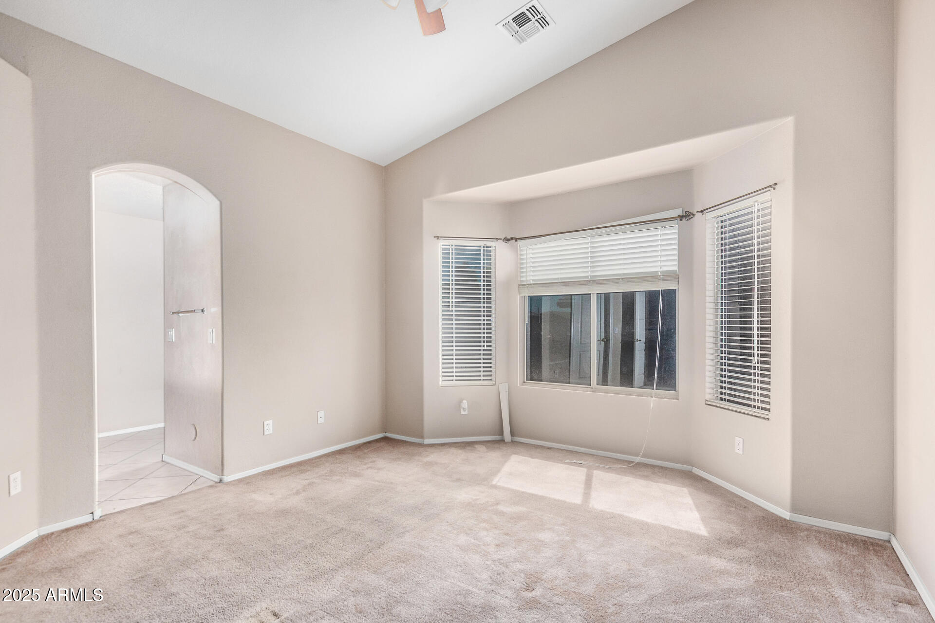 2101 South Meridian Road, Unit 403 Apache Junction, AZ 85120 - Photo 12 of 24 an empty room with windows