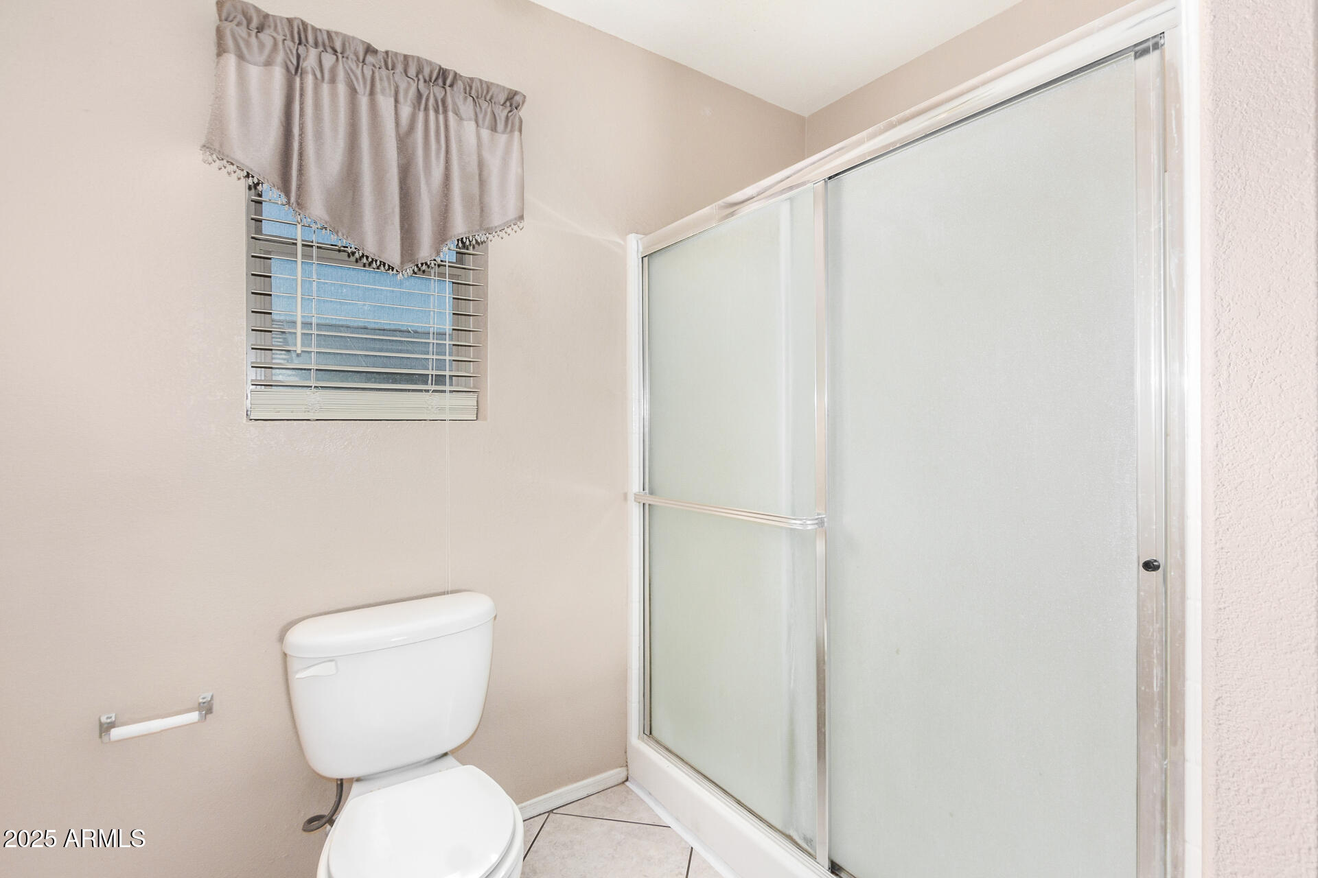 2101 South Meridian Road, Unit 403 Apache Junction, AZ 85120 - Photo 15 of 24 a bathroom with a toilet a sink and a shower