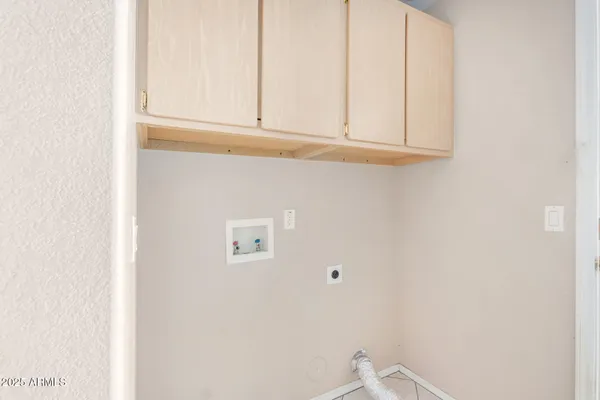a view of a chairs and table in backyard