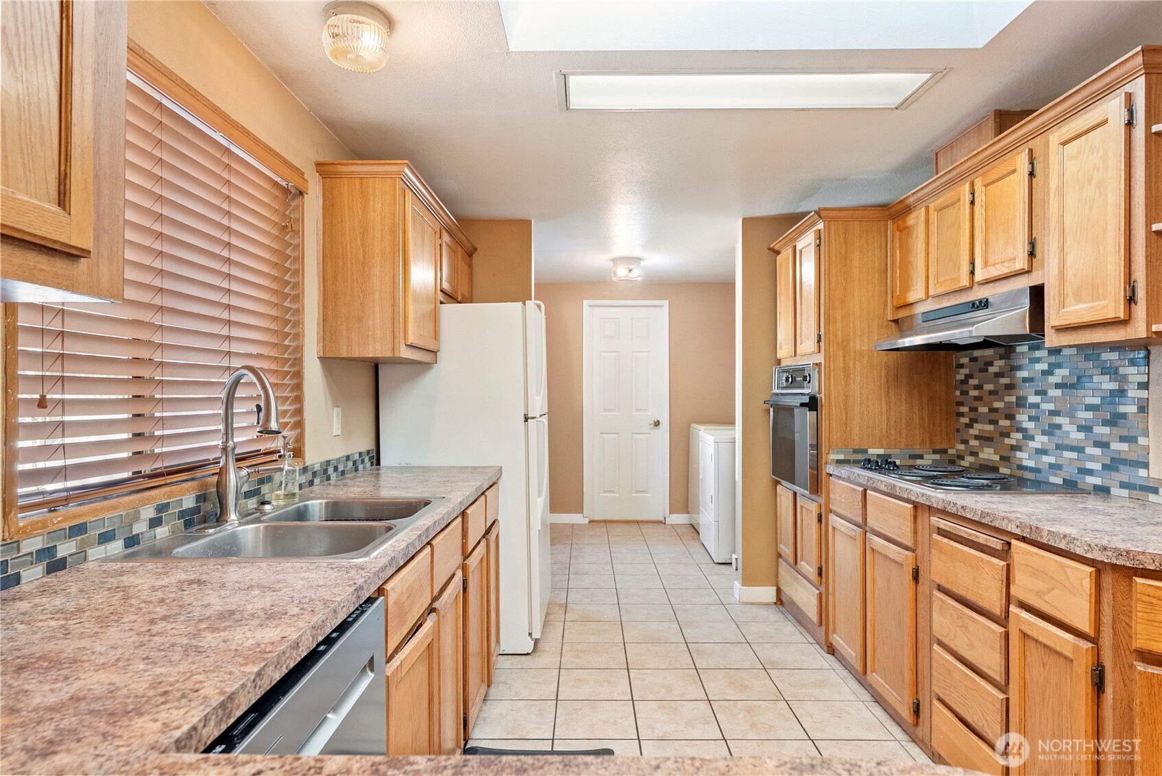 1221 Riverside Avenue Twisp, WA 98856 - Photo 21 of 40 a kitchen with stainless steel appliances granite countertop a sink and a stove