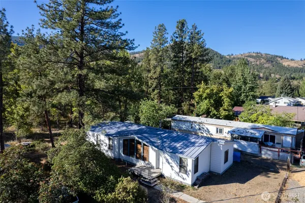 a view of an outdoor sitting area with brick wall