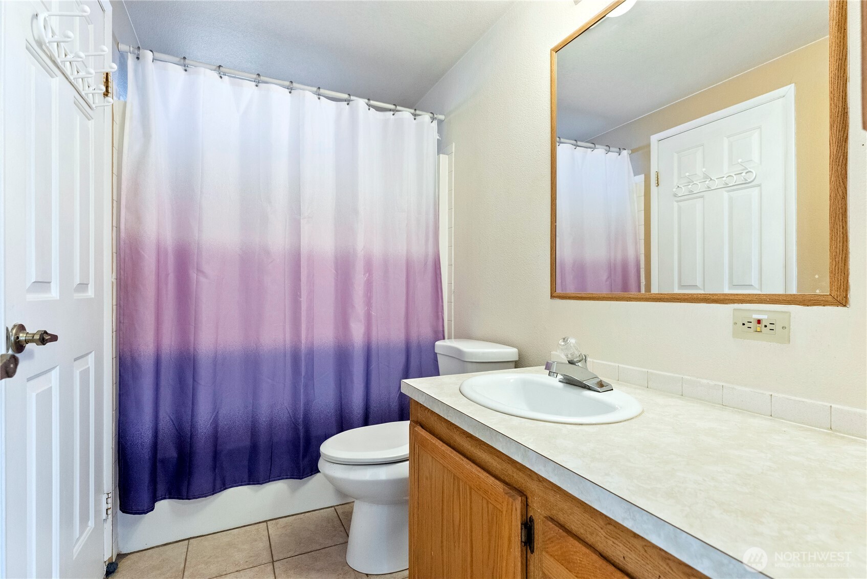 1221 Riverside Avenue Twisp, WA 98856 - Photo 37 of 40 a bathroom with a sink a toilet and a mirror