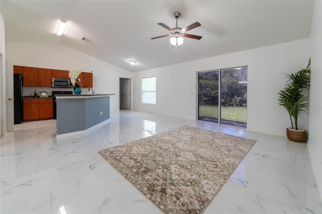 5107 Southwest 165th St Road Ocala, FL 34473 - Photo 5 of 34 a view of kitchen and living room