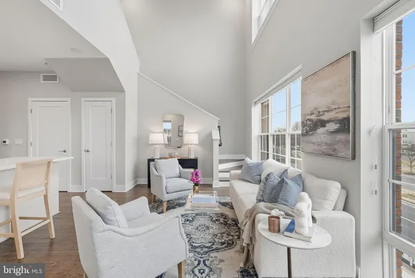 a living room with furniture or outdoor view and a large window