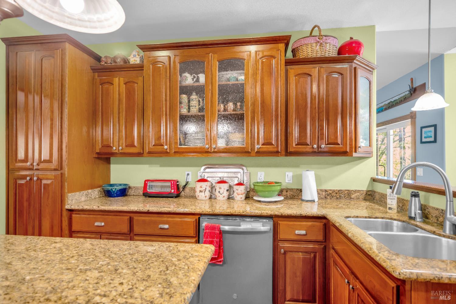 3970 Canyon Road Willits, CA 95490 - Photo 16 of 67 a kitchen with stainless steel appliances granite countertop a sink dishwasher and cabinets with wooden floor
