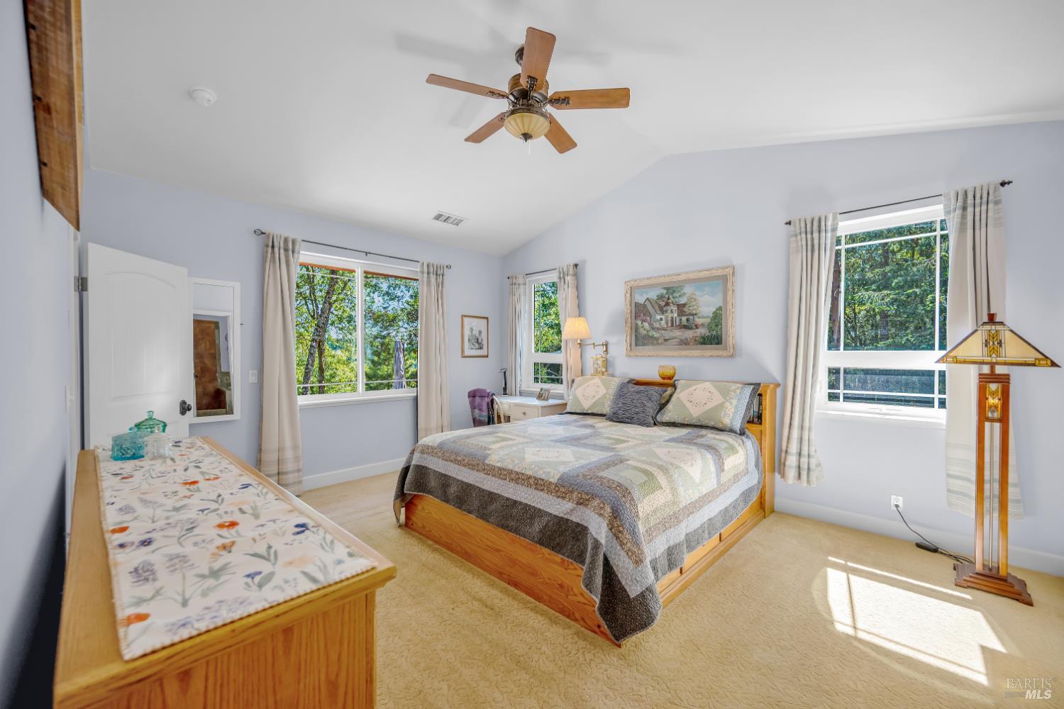 3970 Canyon Road Willits, CA 95490 - Photo 18 of 67 a spacious bedroom with a bed a dresser and a window