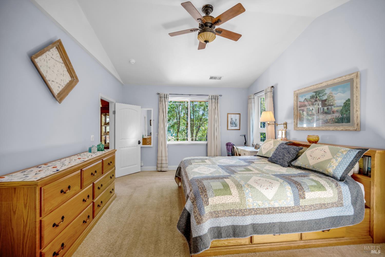 3970 Canyon Road Willits, CA 95490 - Photo 19 of 67 a bedroom with a bed and a chandelier