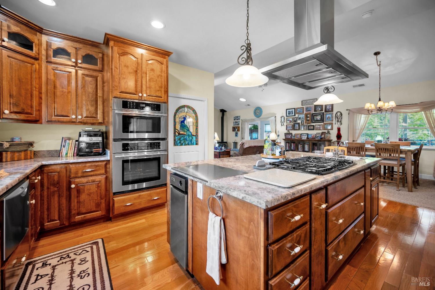 3970 Canyon Road Willits, CA 95490 - Photo 54 of 67 a kitchen with stainless steel appliances granite countertop a stove and a view of living room