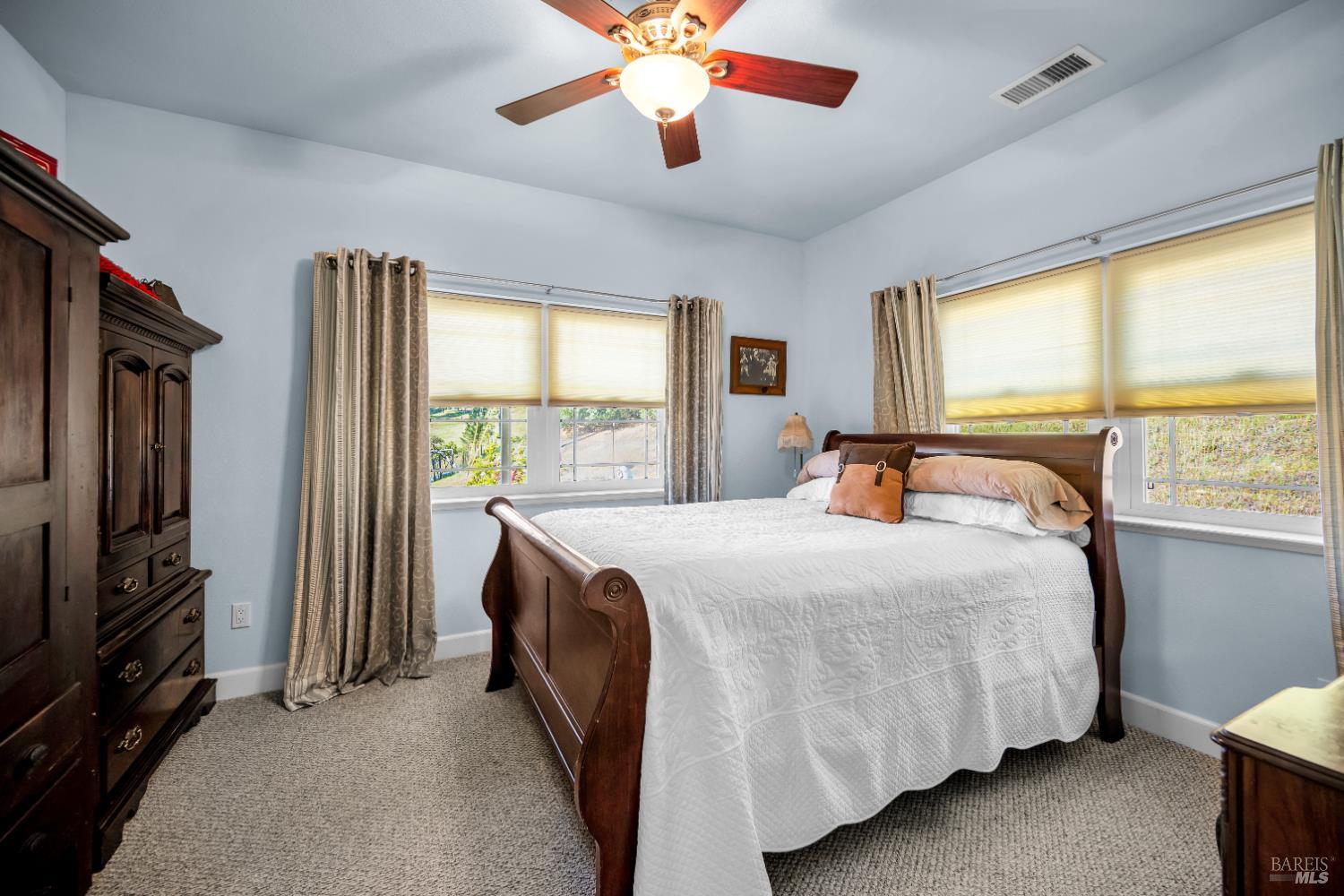 3970 Canyon Road Willits, CA 95490 - Photo 56 of 67 a bedroom with a bed closet and a flat tv screen