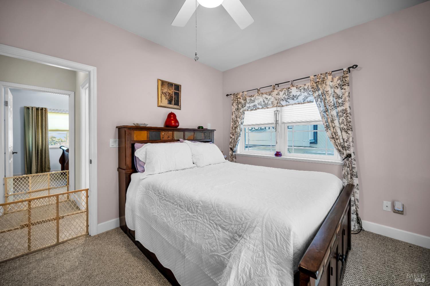 3970 Canyon Road Willits, CA 95490 - Photo 58 of 67 a bedroom with a bed and a chandelier
