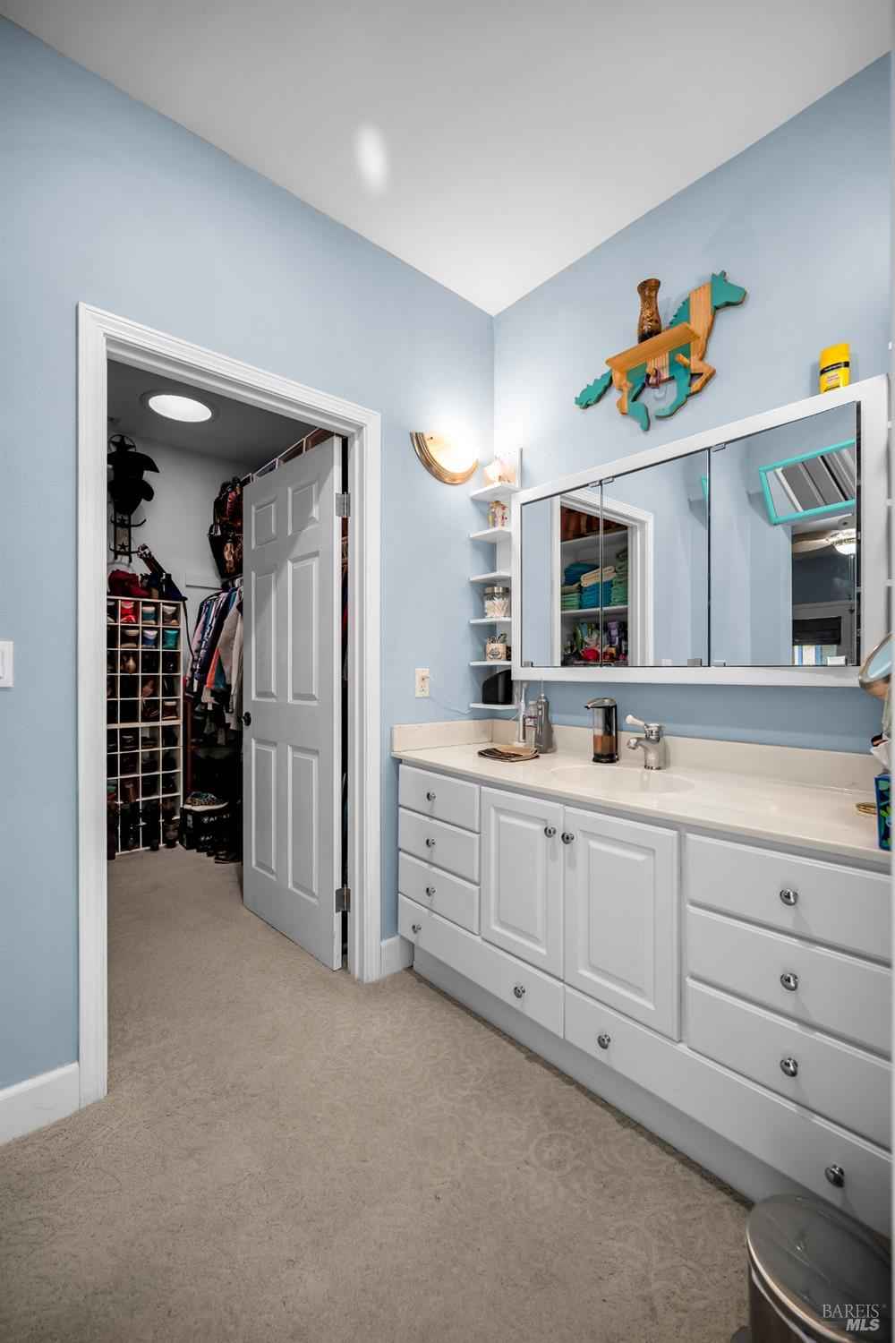 3970 Canyon Road Willits, CA 95490 - Photo 63 of 67 a spacious en suite bathroom with a double vanity sink and a mirror