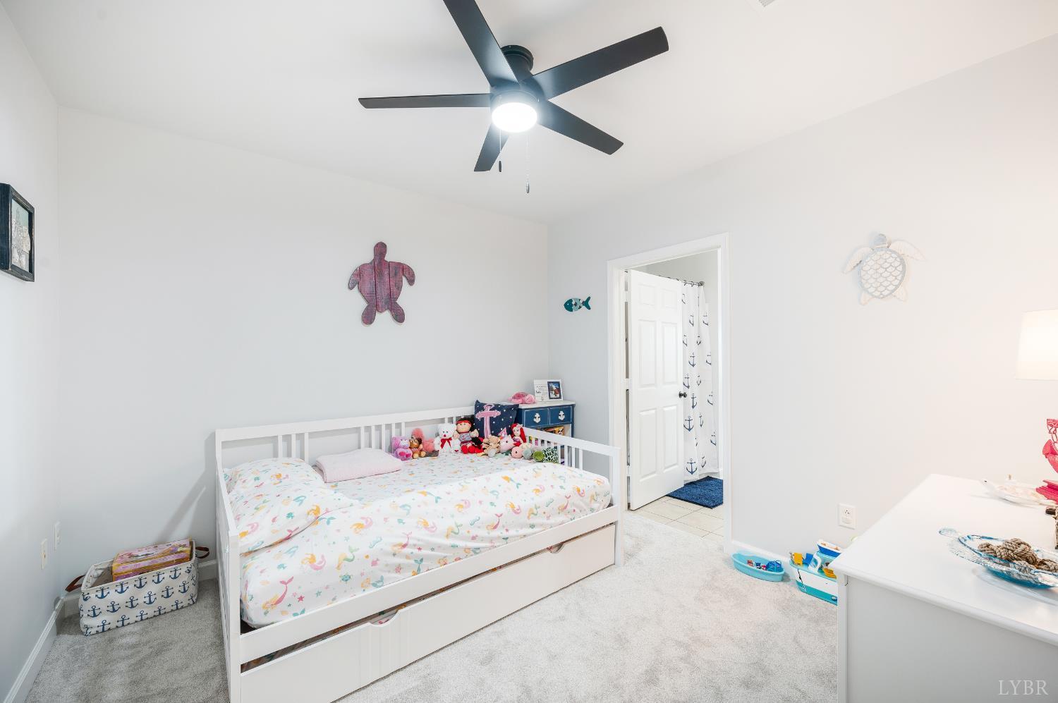 1245 Graves Harbor Trail, Unit 212 Huddleston, VA 24104 - Photo 17 of 60 a bedroom with a bed and a chandelier