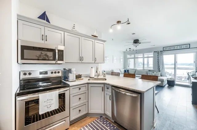 a kitchen with a sink and a stove top oven