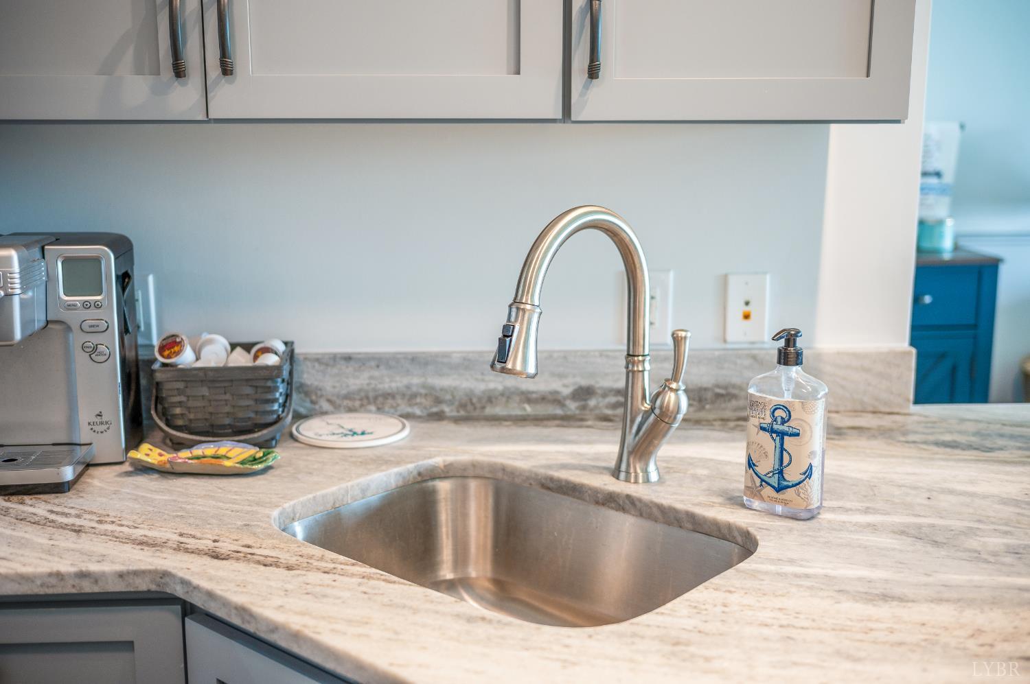 1245 Graves Harbor Trail, Unit 212 Huddleston, VA 24104 - Photo 21 of 60 a kitchen with a sink and a stove top oven