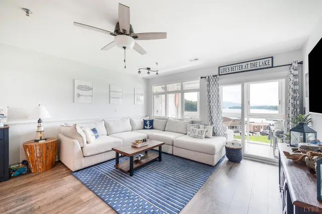 a living room filled with furniture and a large window