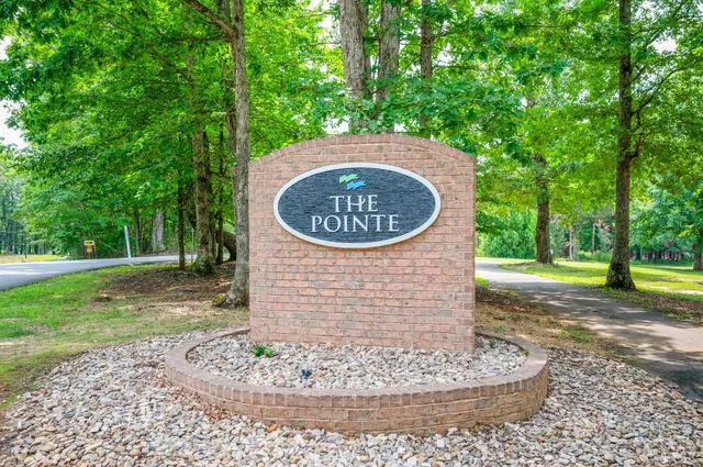 a view of a patio with dining table and chairs