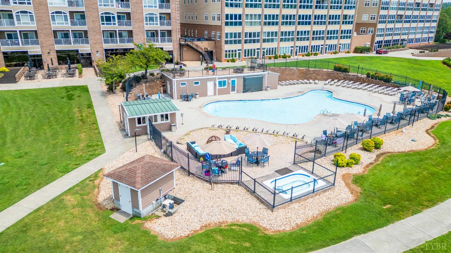 1245 Graves Harbor Trail, Unit 212 Huddleston, VA 24104 - Photo 41 of 60 a swimming pool with outdoor seating and yard