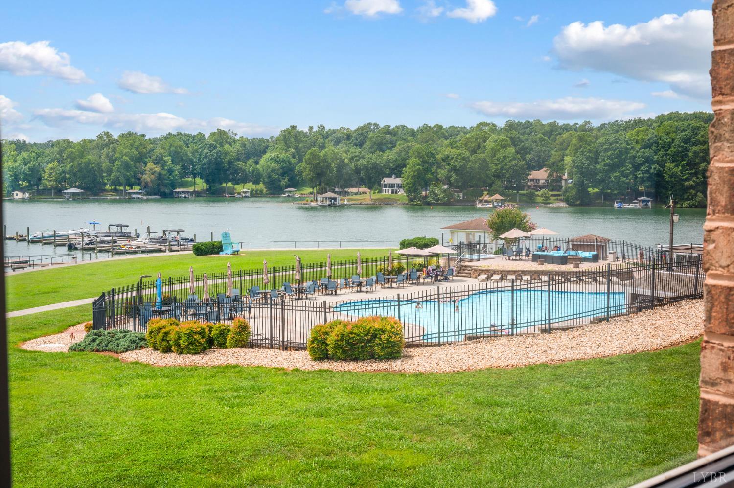 1245 Graves Harbor Trail, Unit 212 Huddleston, VA 24104 - Photo 42 of 60 a view of a lake with a city view