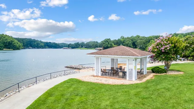 an aerial view of a house with garden space and street view