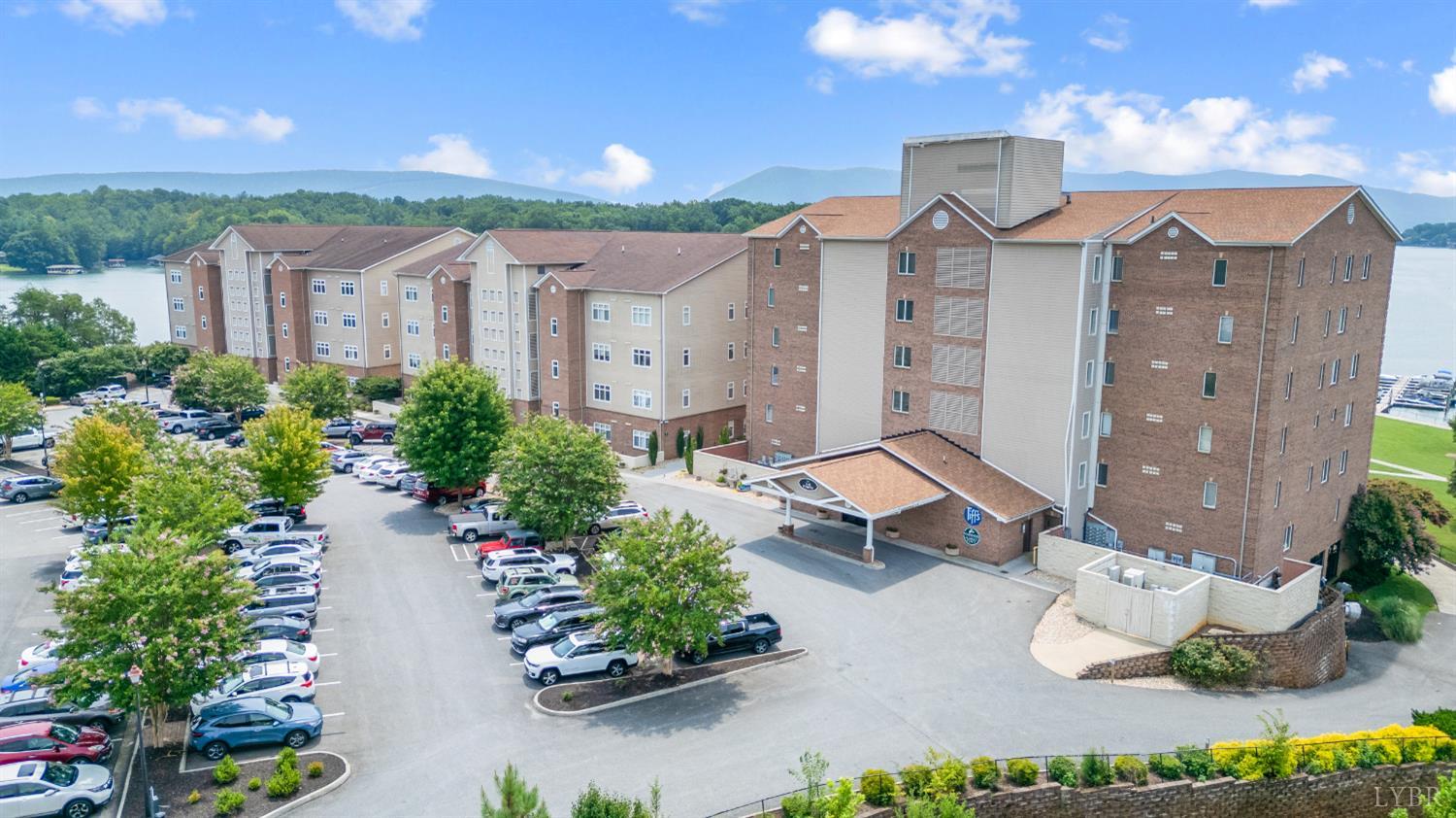 1245 Graves Harbor Trail, Unit 212 Huddleston, VA 24104 - Photo 56 of 60 an aerial view of a house with garden space and street view