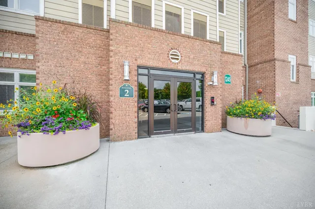 a view of a livingroom with furniture and a fan