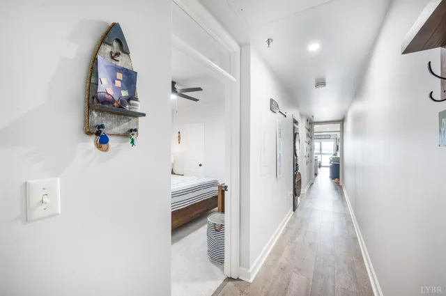 a bedroom with a bed and a ceiling fan