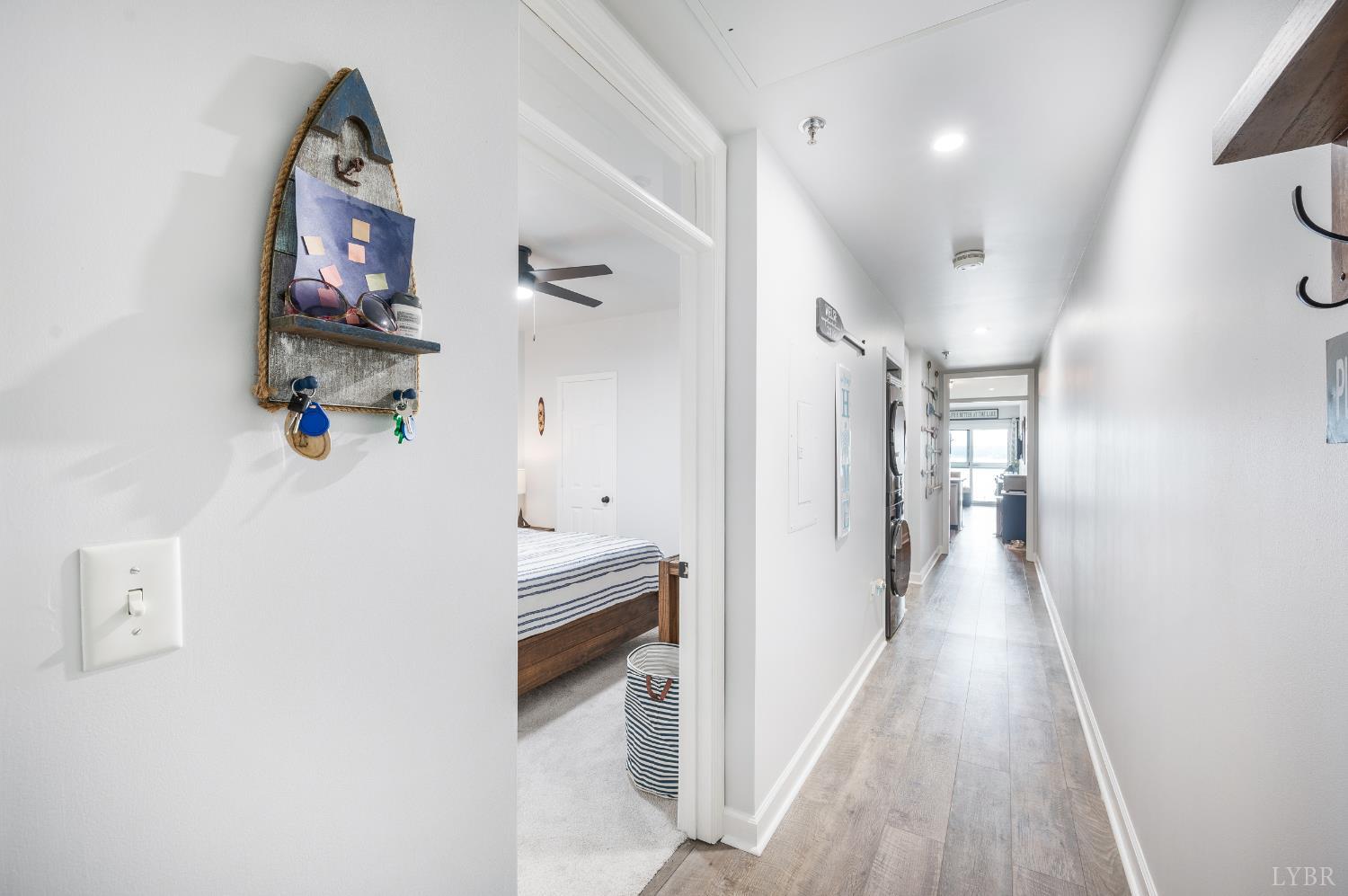 1245 Graves Harbor Trail, Unit 212 Huddleston, VA 24104 - Photo 9 of 60 a view of a hallway view with wooden floor and staircase