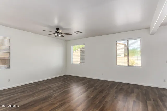 a view of a room with wooden floor
