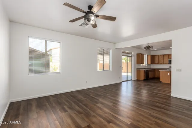 a kitchen with a refrigerator sink and cabinets